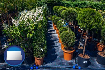 shrubs and trees at a nursery - with North Dakota icon